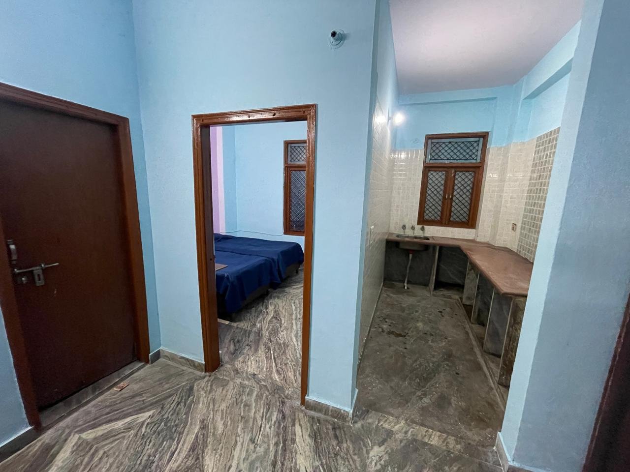 Hostel corridor and facilities at Sunrise Girls PG