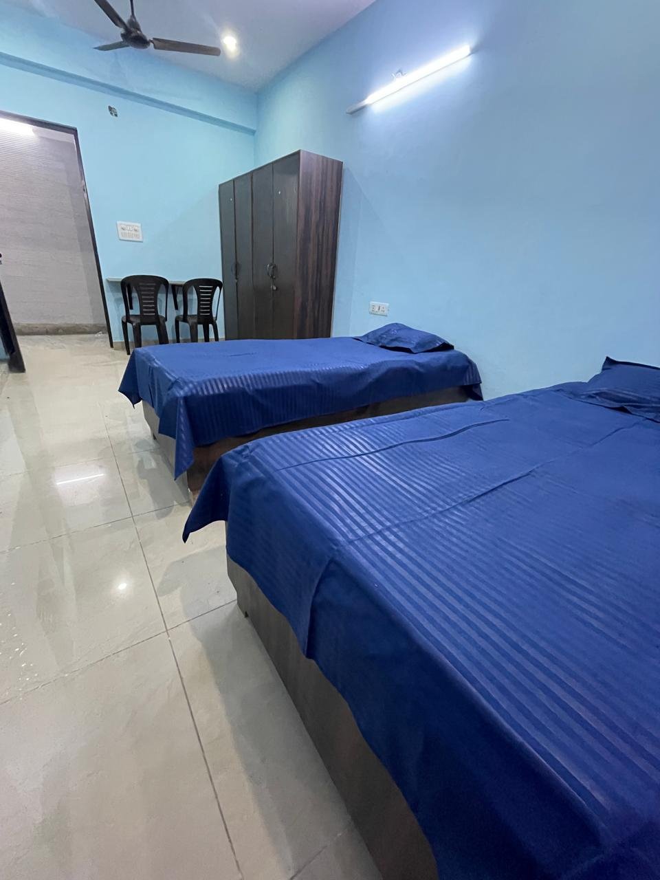 Twin sharing room with wardrobe at Sunrise Girls PG Ashok Vihar Delhi